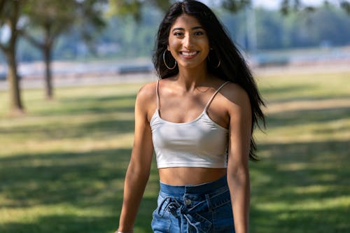 Free Selective Focus Photo of a Model Wearing a White Spaghetti Strap Top Stock Photo