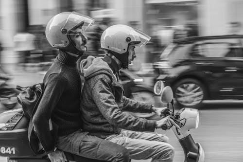 Free Grayscale Photo of Men Riding a Motorcycle Stock Photo