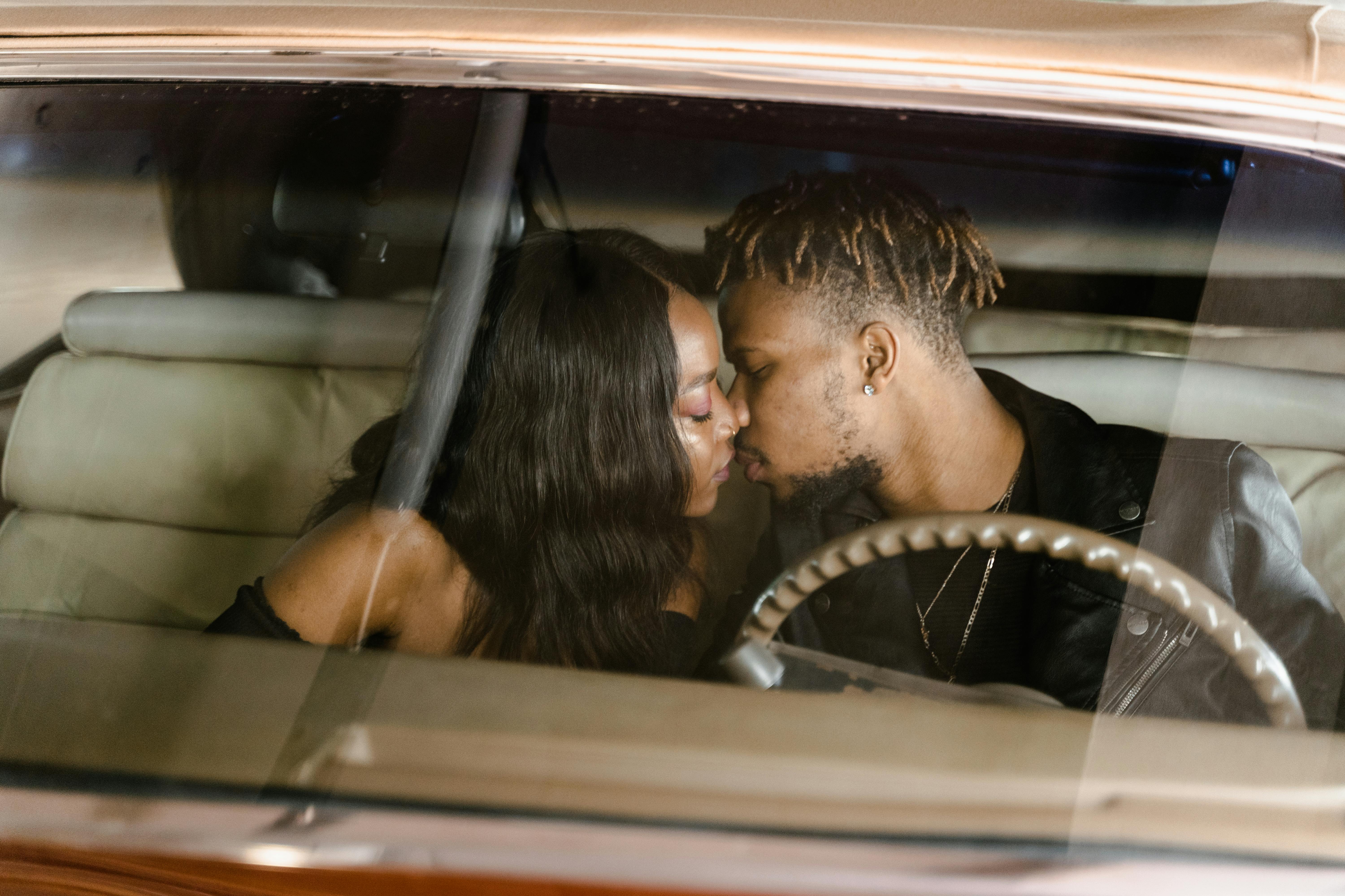 A Couple Kissing in the Car · Free Stock Photo