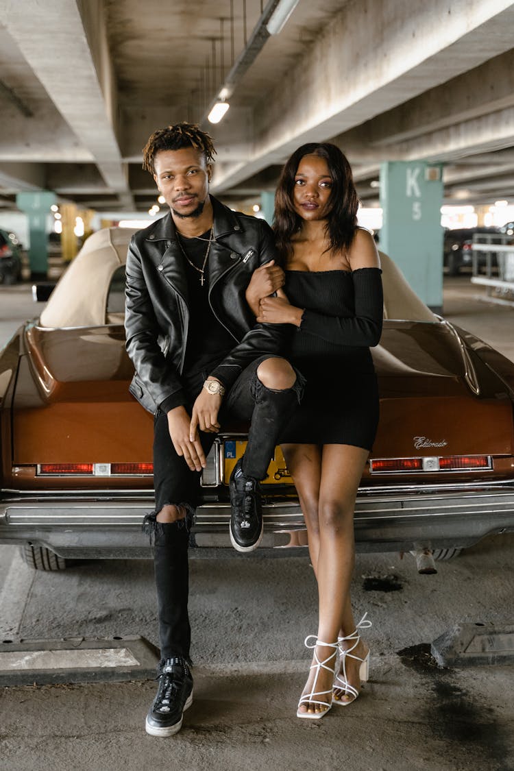 Stylish Black Couple Near Car