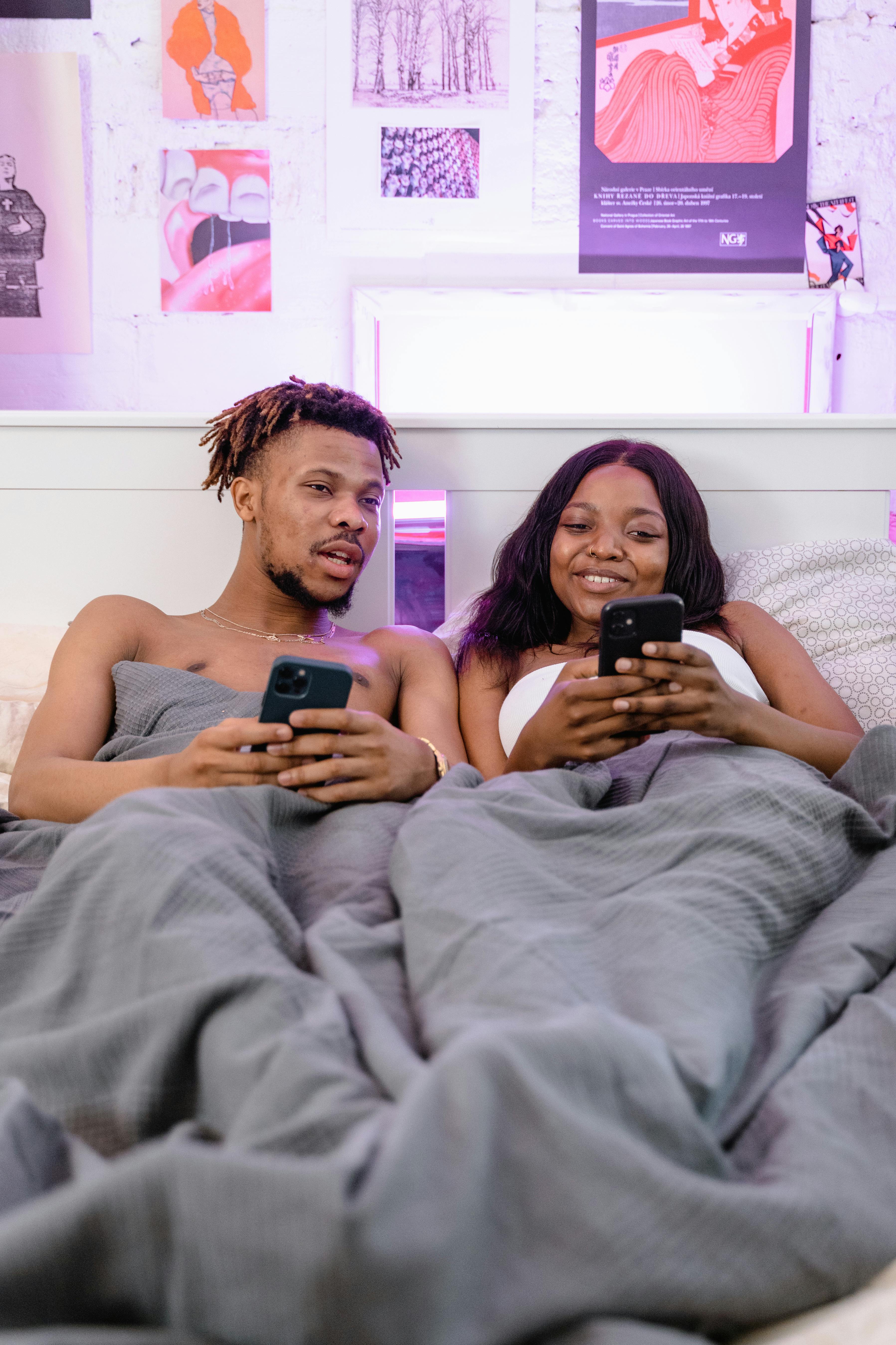 Young couple on phones instead of talking to each other