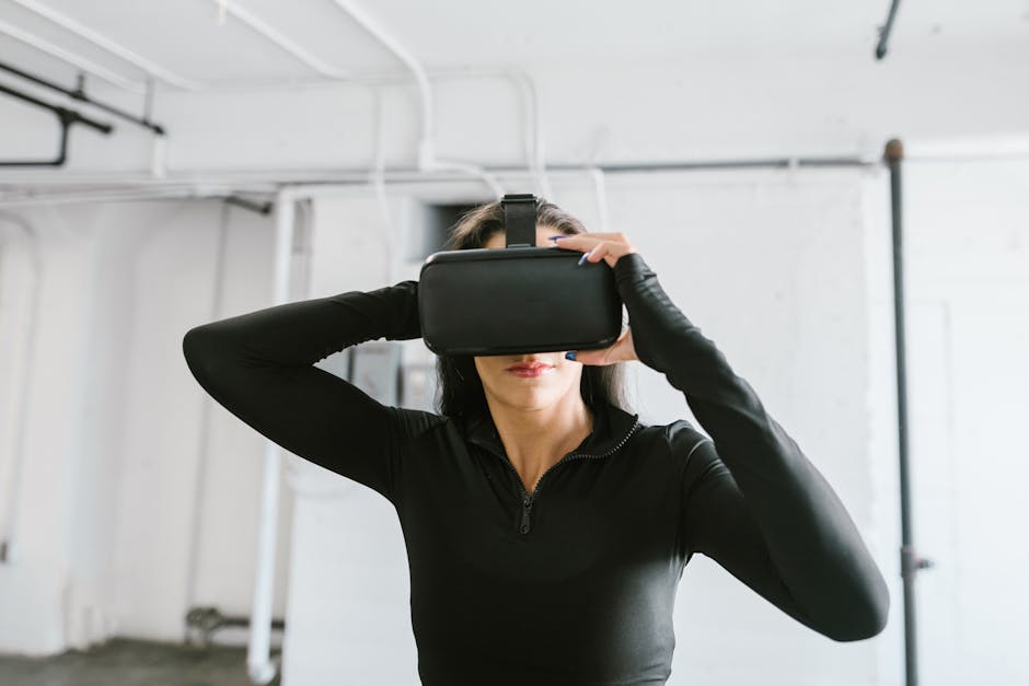 Woman wearing black long sleeve using virtual reality headset indoors, exploring immersive technology.