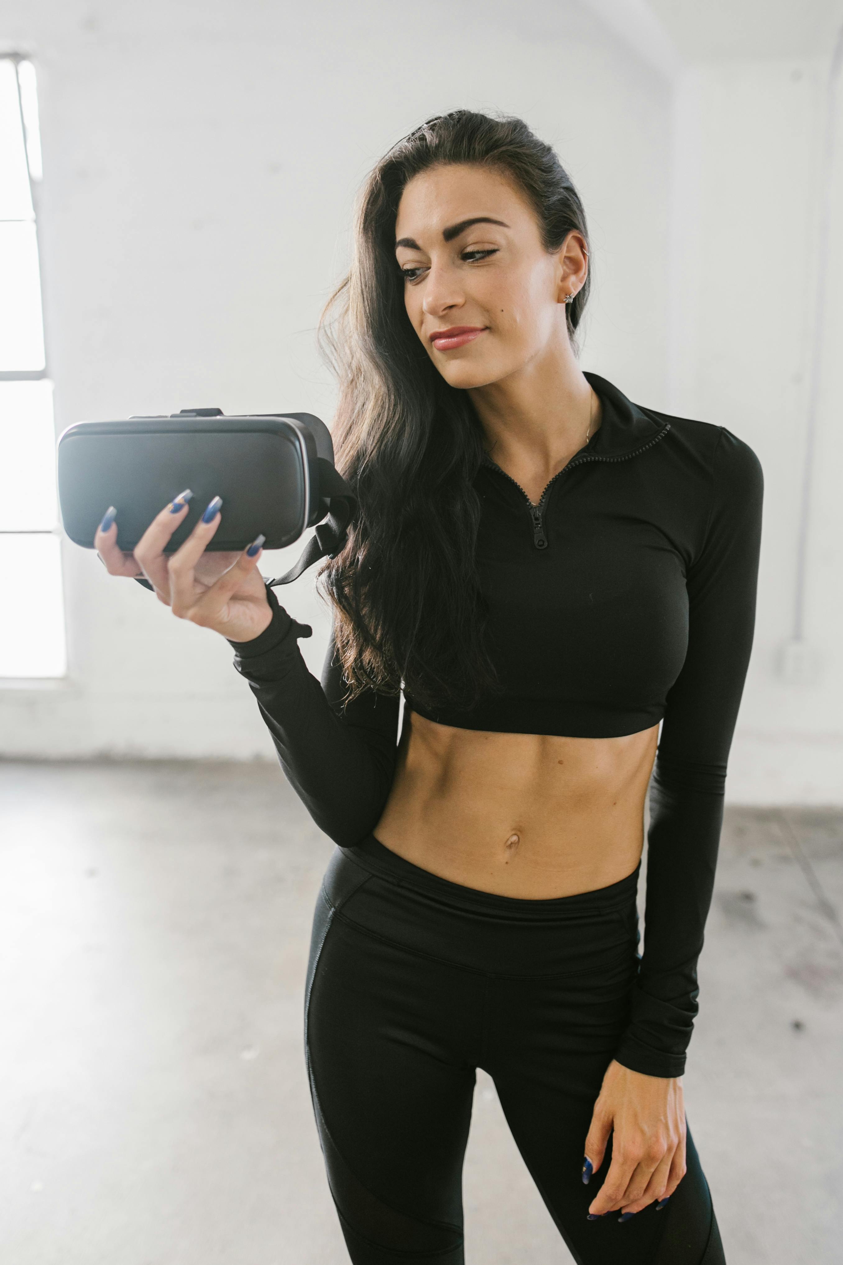 a woman holding a virtual reality headset