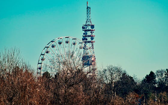 Photo of a Ferris Wheel Beside Tower