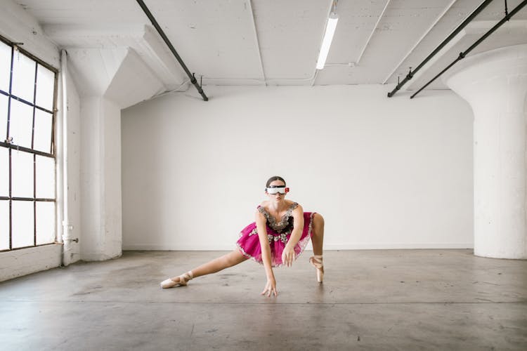 Woman In Ballet Pose Touching Floor