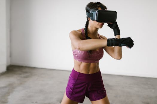 A woman practices boxing while using virtual reality goggles indoors, showcasing tech-integrated fitness.