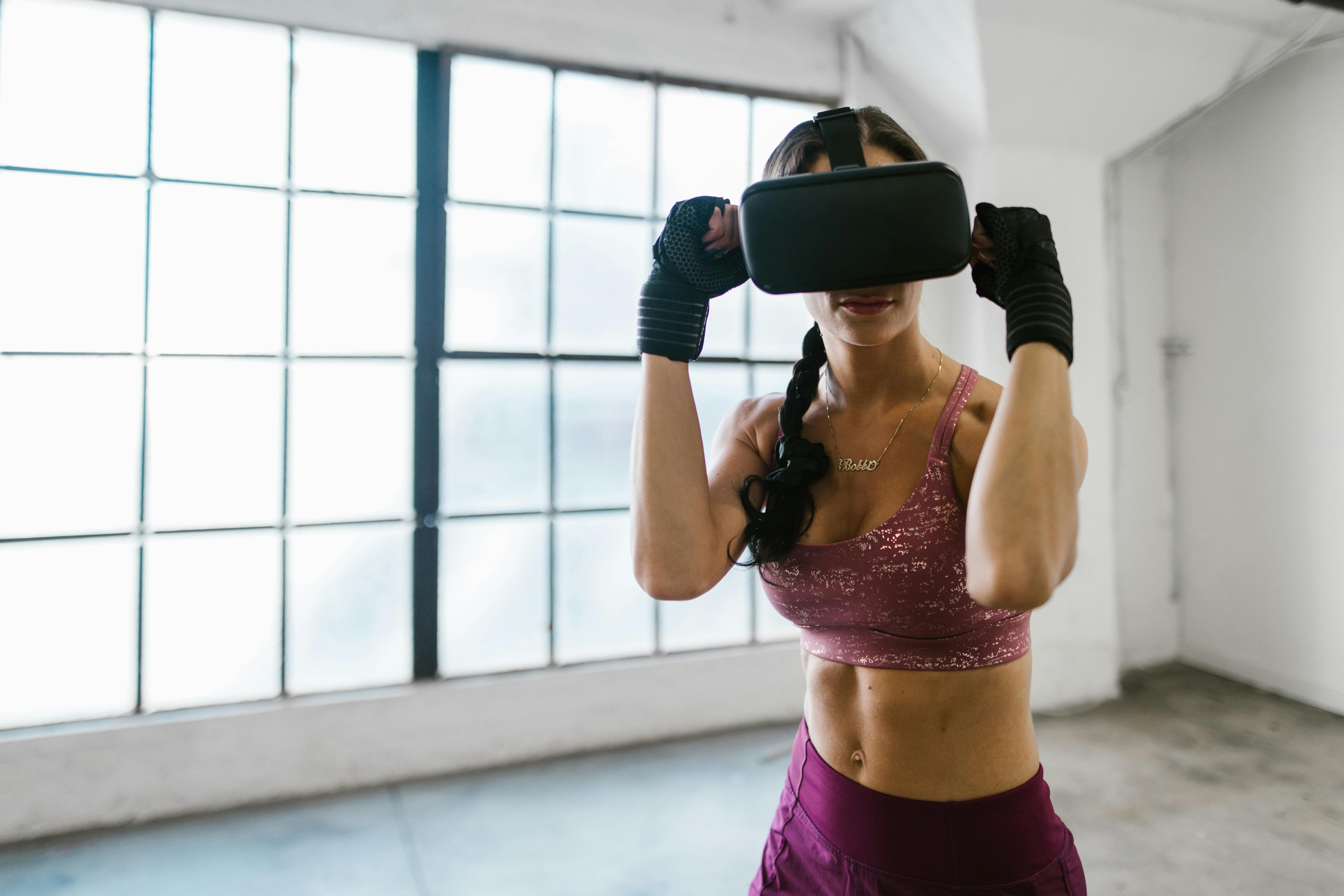 fit woman using virtual reality glasses