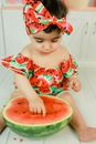 Adorable Child poking a Watermelon