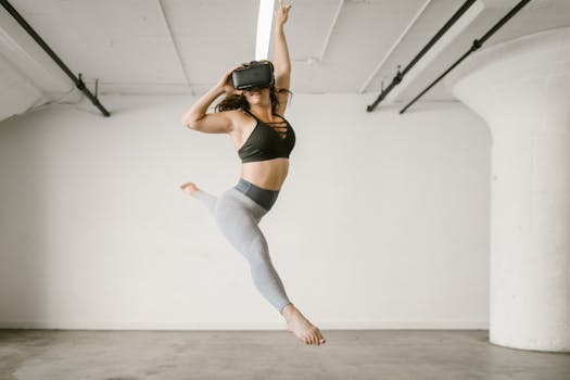 Young woman dancing with VR headset in a modern indoor setting.