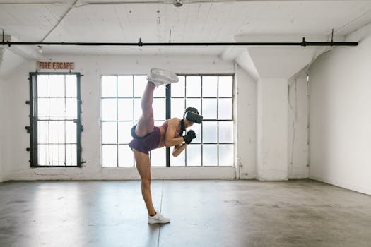 Woman using VR headset for fitness training. Full shot in an industrial-style studio.
