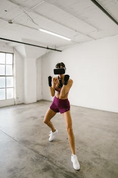 Woman practicing fitness with VR headset in minimalistic indoor space.