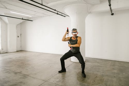 Man using Nunchaku while wearing Virtual Reality Glasses