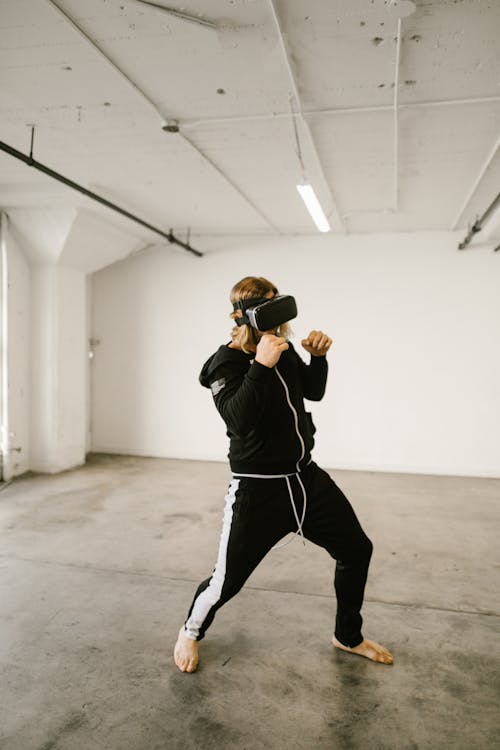 Free Man Playing Boxing on a Virtual Reality Headset Stock Photo