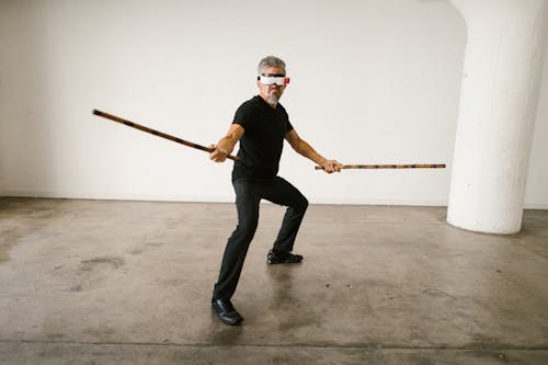 Foto profissional grátis de arnis, artes marciais, coreografia