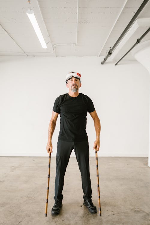 Man using an Arnis while wearing Virtual Reality Glasses