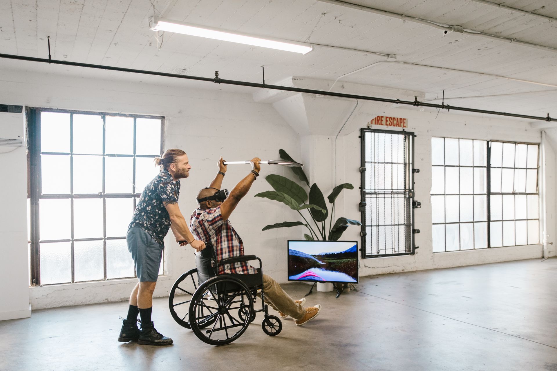 Patient in a wheelchair using a VR headset during a therapeutic virtual reality session