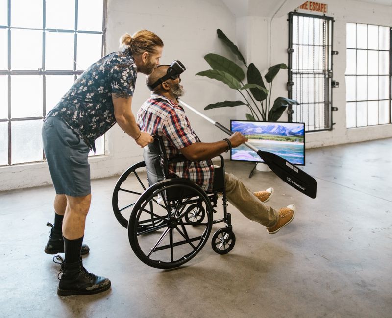 A therapist using a virtual reality headset with a client during a trauma recovery session