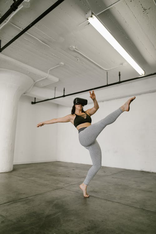 Free Woman dancing while wearing Virtual Reality Glasses Stock Photo