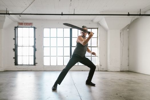 A Man Weilding a Machete