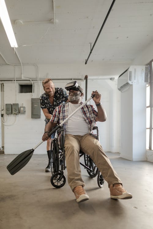 Man paddling while wearing Virtual Reality Glasses