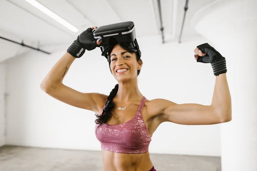 Hispanic woman in activewear flexing her muscles while wearing a VR headset, smiling confidently indoors.