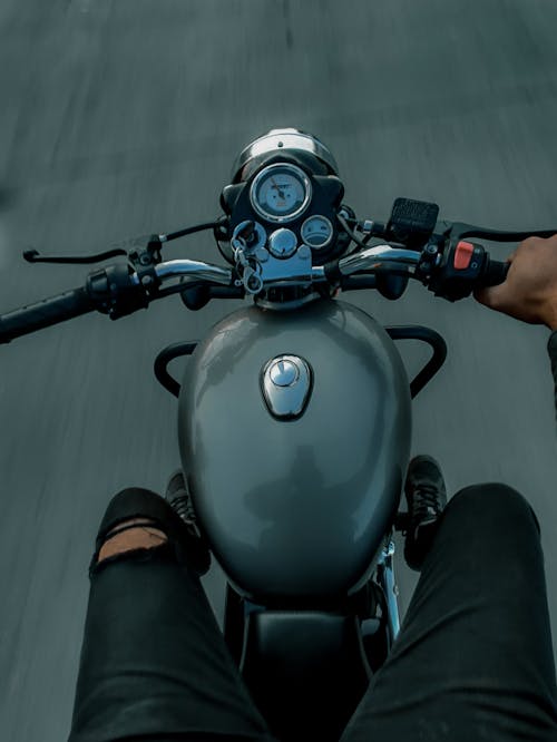 Person in Black Pants Riding on a Motorcycle