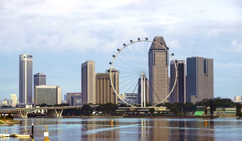 Free View of Singapore skyline featuring the iconic Singapore Flyer and waterfront. Stock Photo