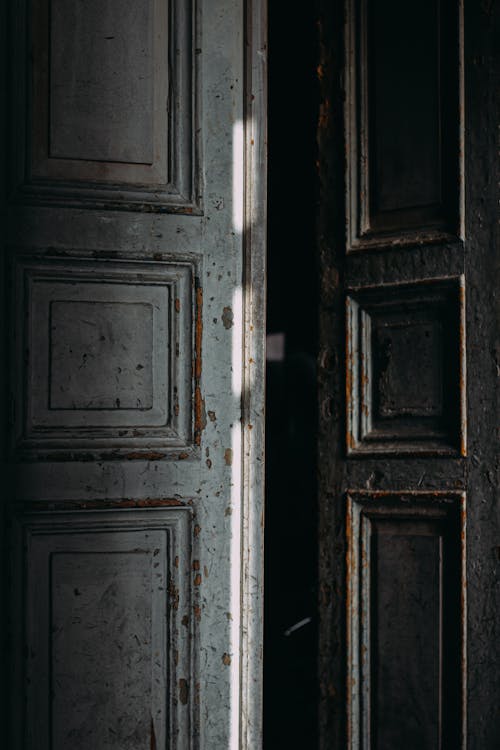 Ajar door of shabby building