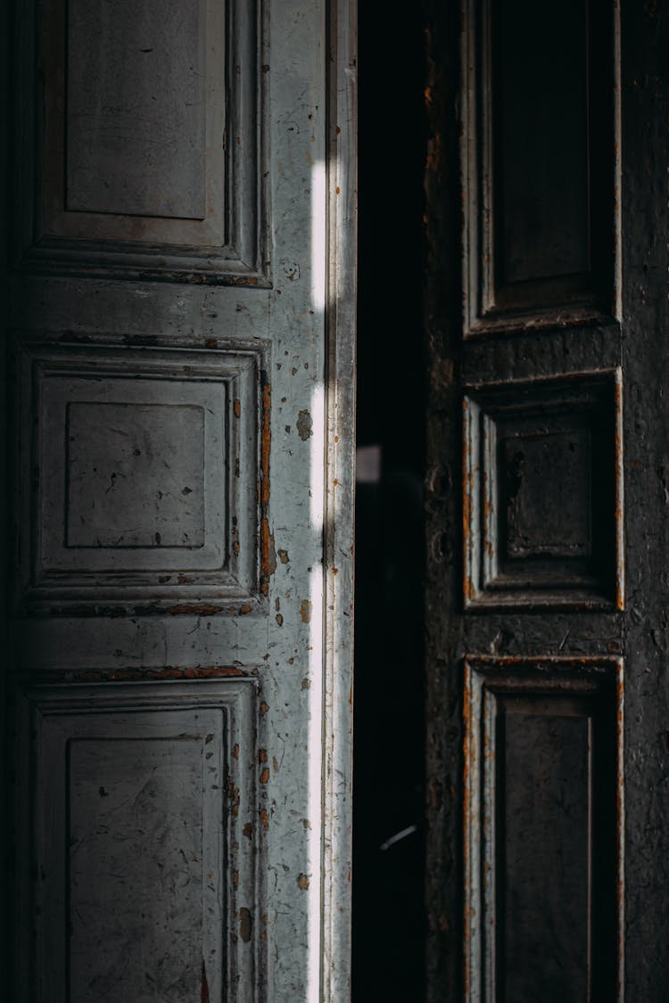 Ajar Door Of Shabby Building