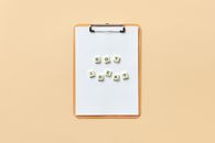Clipboard with 'Got Idea?' spelled with letter tiles on neutral background.