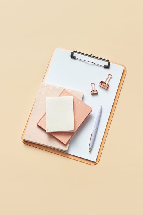 Various Office Supplies On Beige Background