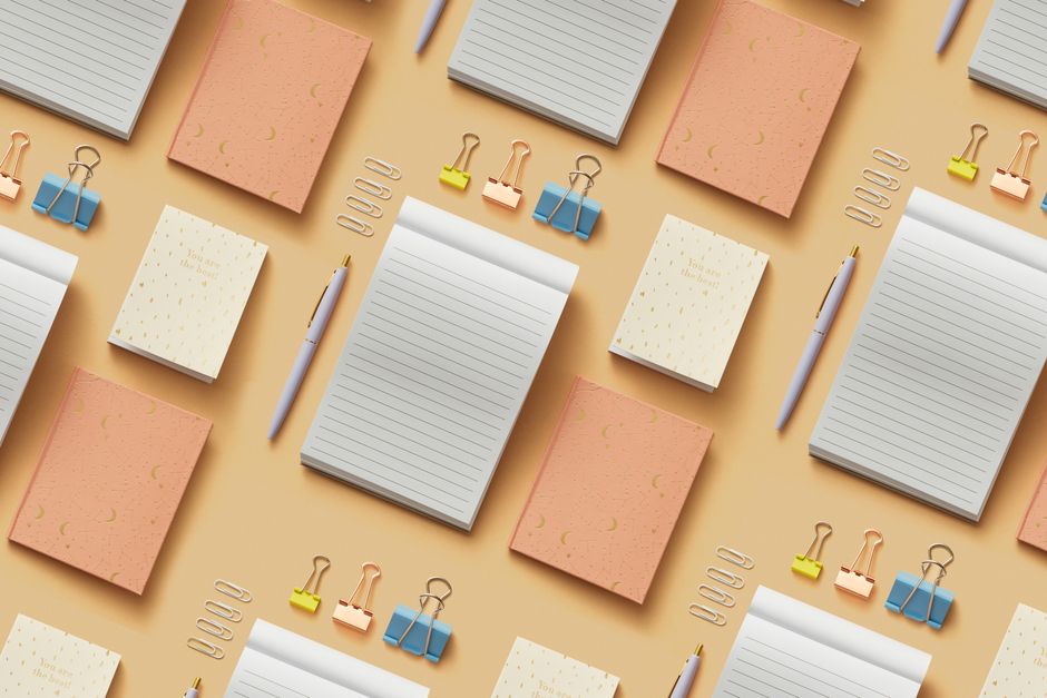 A vibrant flat lay of colorful office and school supplies on a desk.