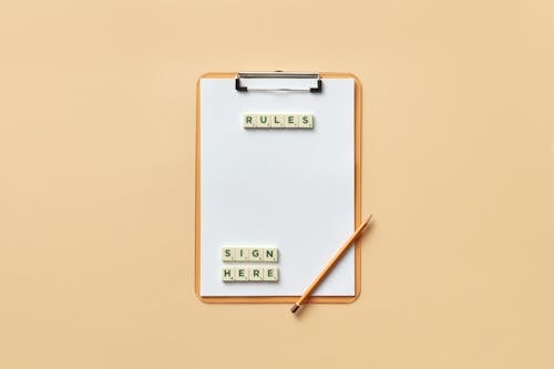 Pencil and Letter Tiles on a Clipboard