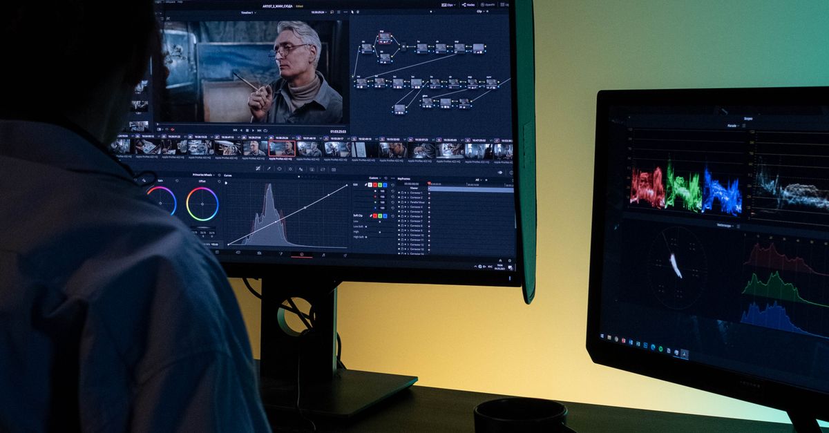 Backview of an Editor working on a Computer · Free Stock Photo