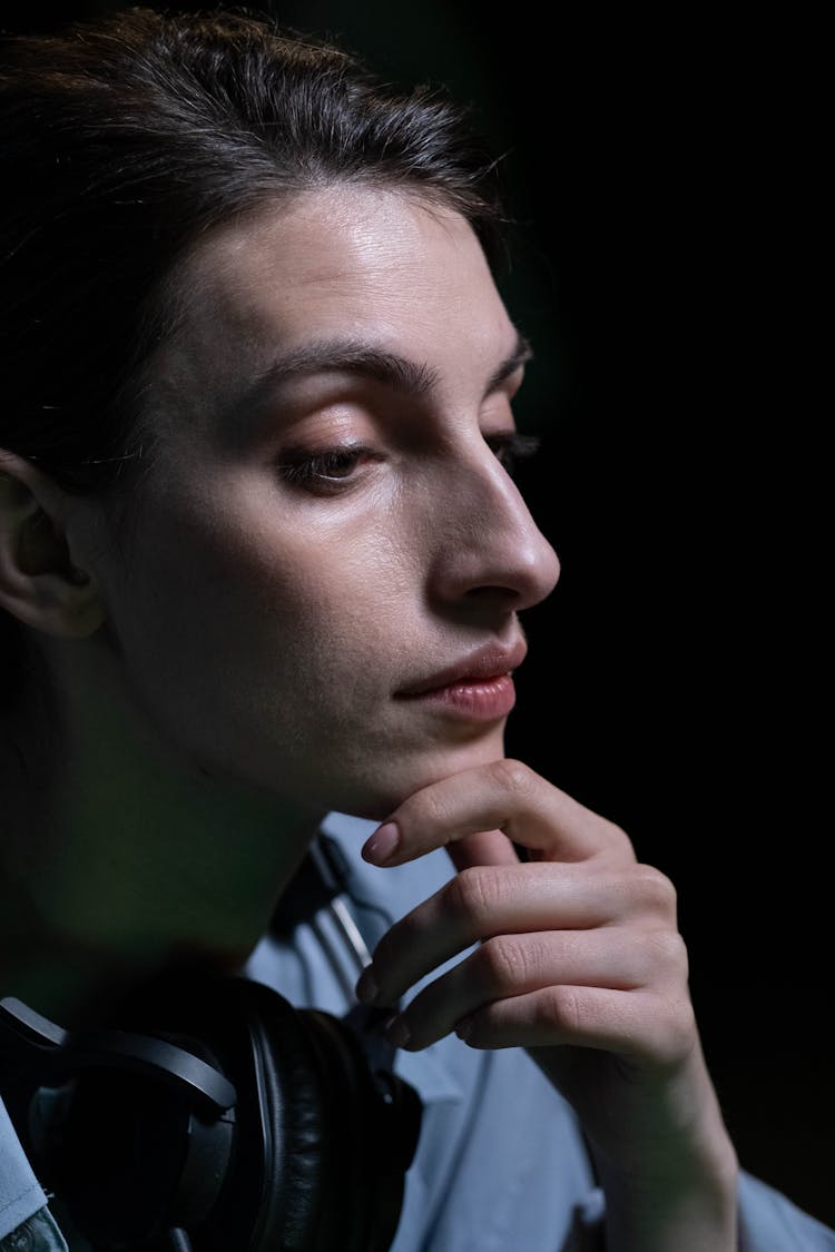 Close Up Shot Of A Woman Holding Her Chin