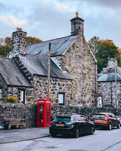 Cars Parked Beside Stone House