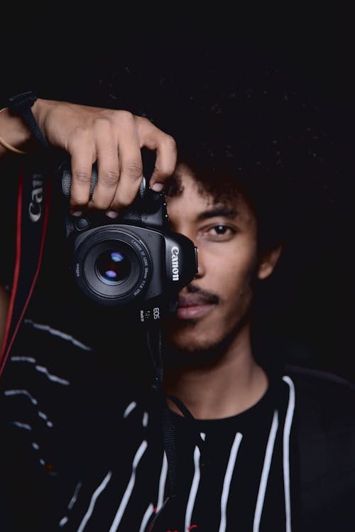 Free Man Holding a Camera Stock Photo