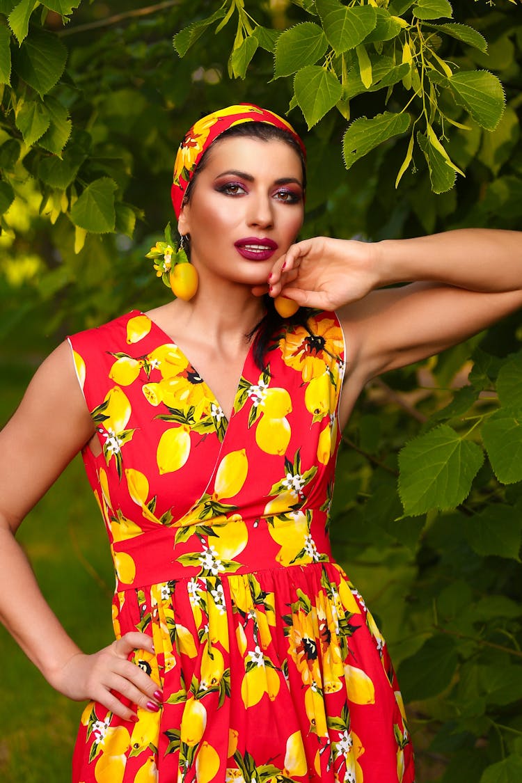 Woman In Yellow And Red Floral Dress With Headband