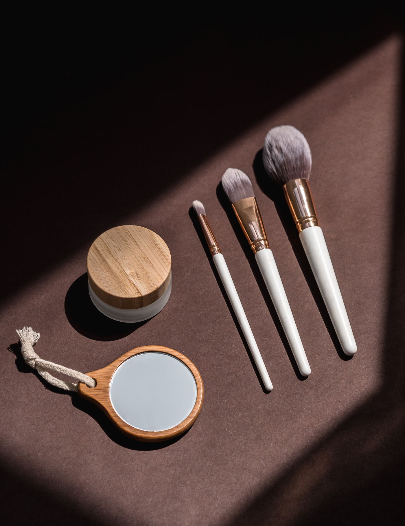Makeup brushes arranged in an elegant beauty setting