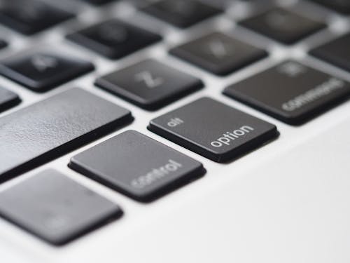 Free Close-Up Photography of Macbook Keyboard Stock Photo