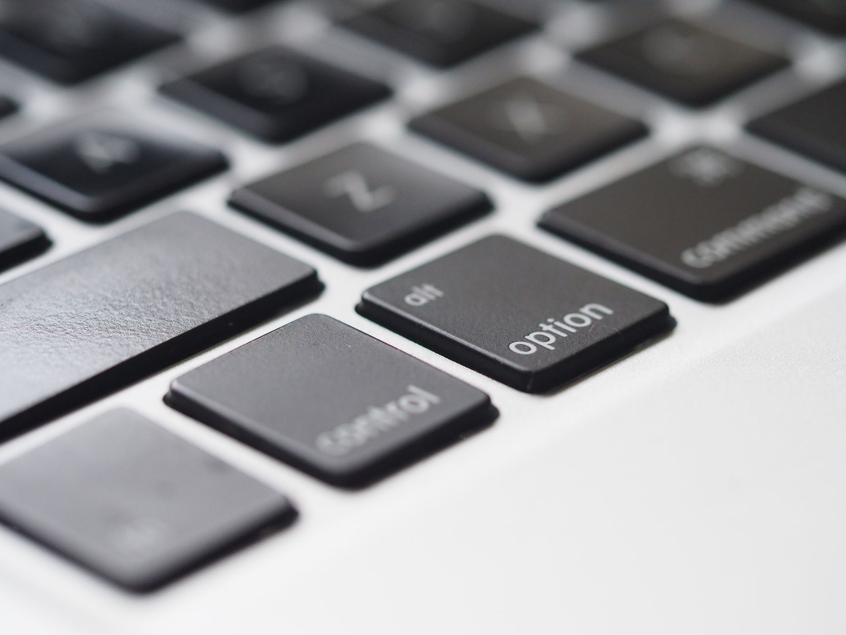 Detailed close-up image of laptop keyboard keys, showcasing modern tech design and depth of field effect.