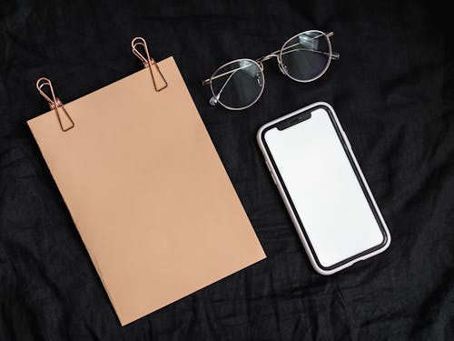 Smartphone Beside a Blank Paper