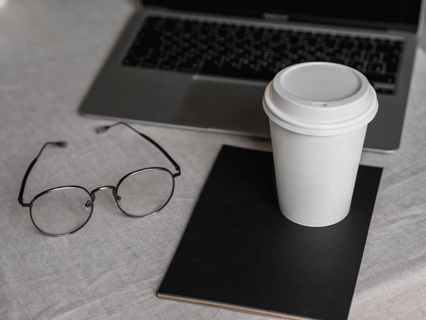 home desk or kitchen table before work starts coffee mug notebook task list lifestyle photo 1