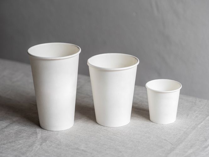 Three white eco-friendly paper cups of different sizes