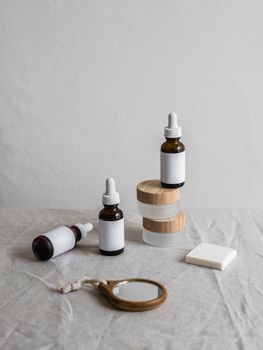 Elegant display of skincare bottles with neutral tone background, ideal for beauty branding.