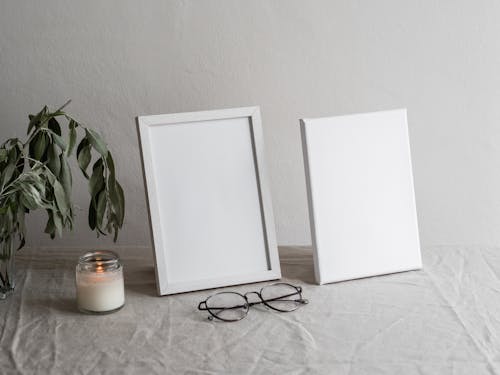 White Photo Frames on Table 