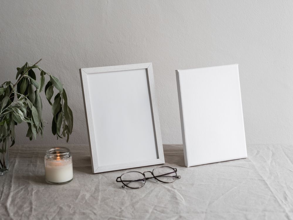 White Photo Frames on Table · Free Stock Photo