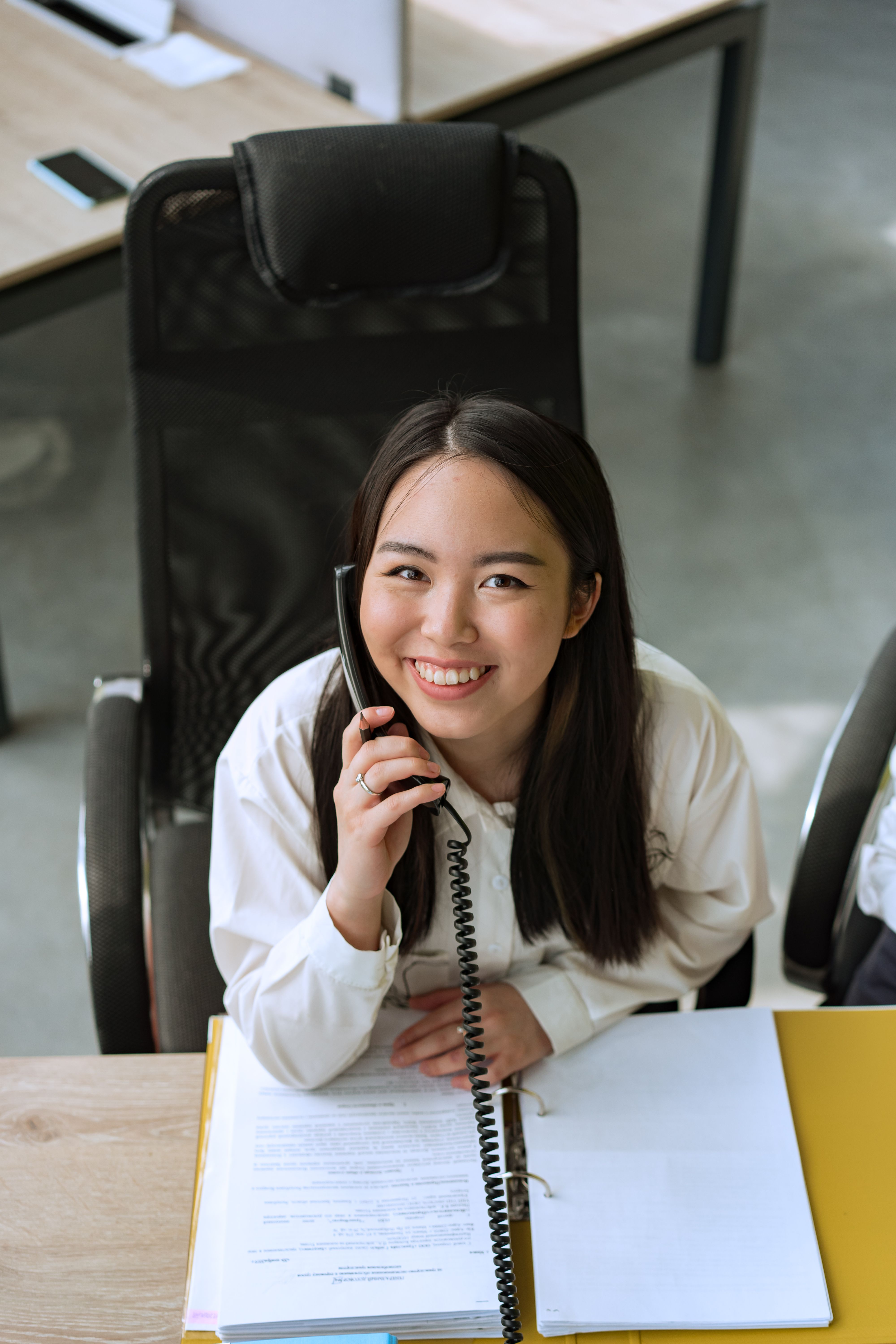 Friendly professional taking a phone call in an office