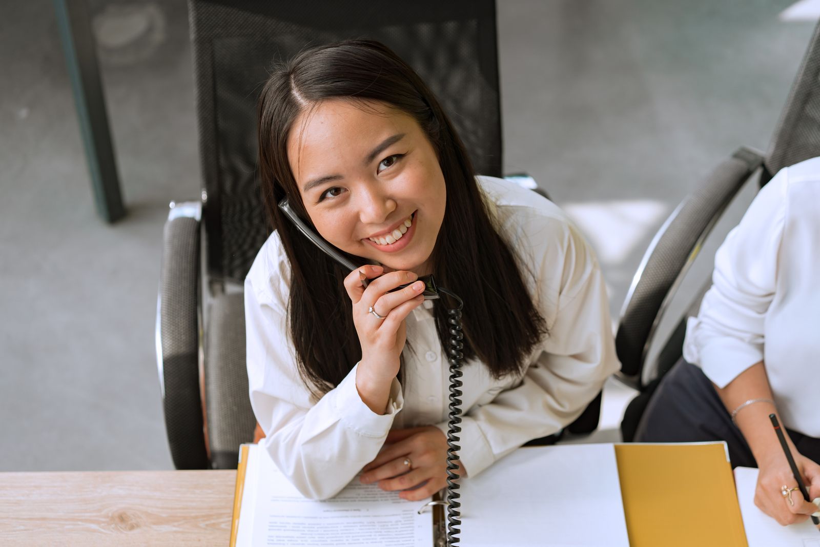 Friendly customer service professional answering a phone call