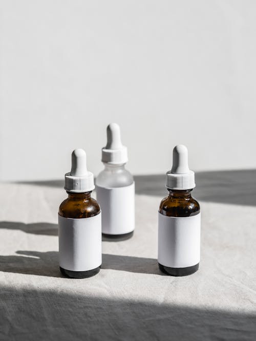 Close-up Photo of Serum Bottles 